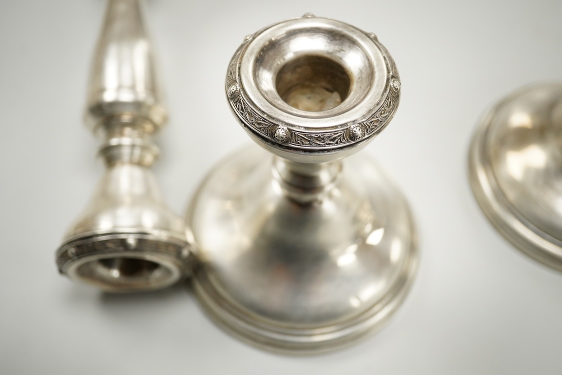 A suite of three Elizabeth II silver mounted candlesticks, comprising a pair, 20.3cm and a single dwarf candlestick, Adie Brothers, Birmingham, 1956.